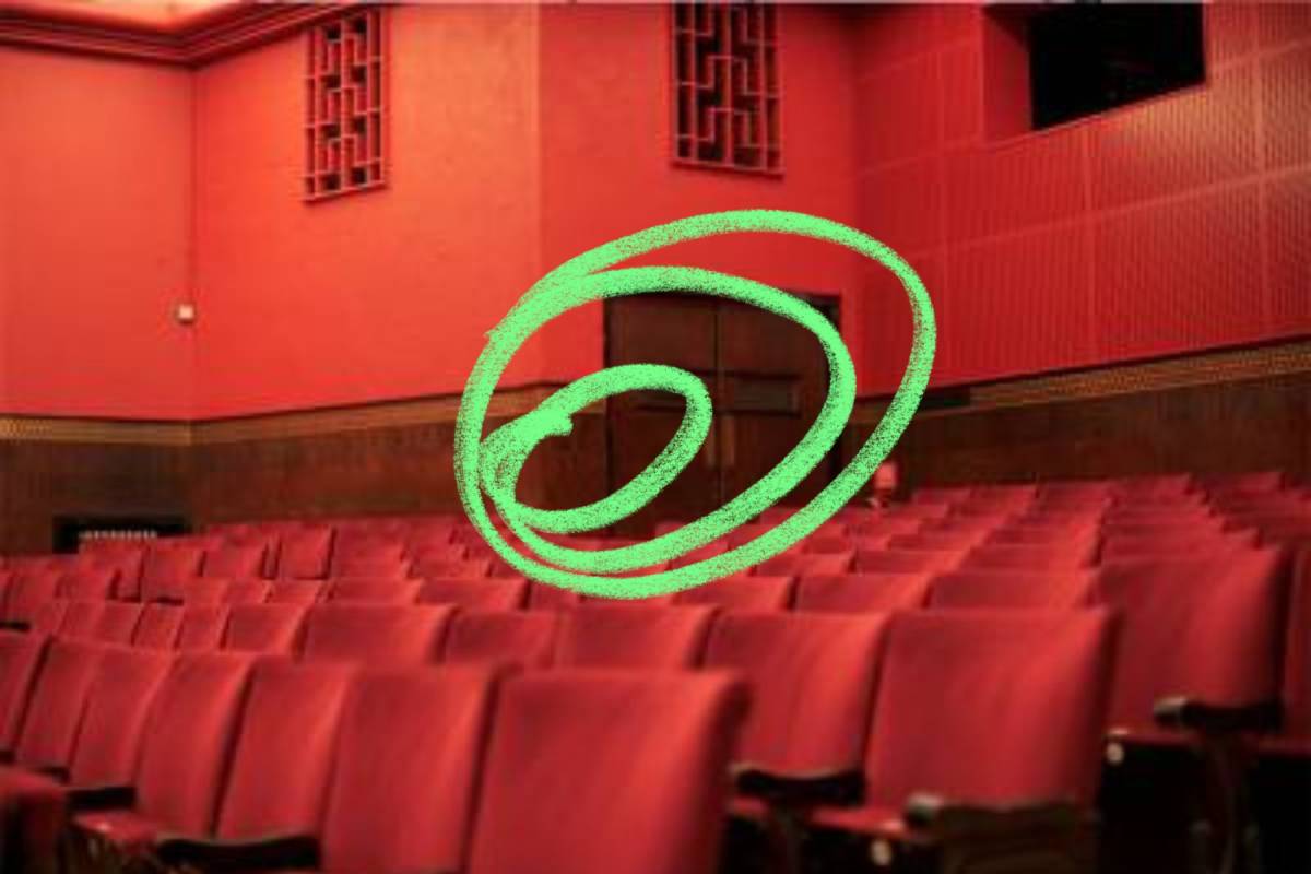 An empty theatre space illustrated with a neon green squiggle