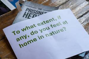 A piece of paper which says 'To what extent, if any, do you feel at home in nature?'