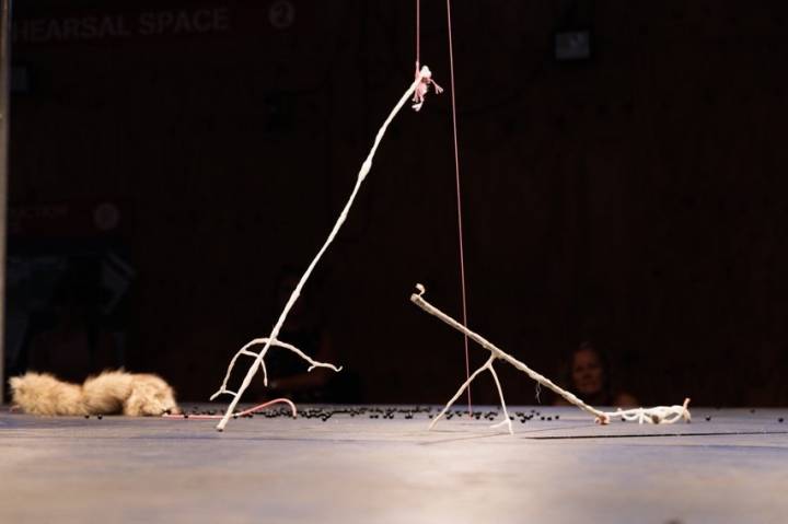 An image of some stick-like, stranger and fragile puppets in a desolate landscape